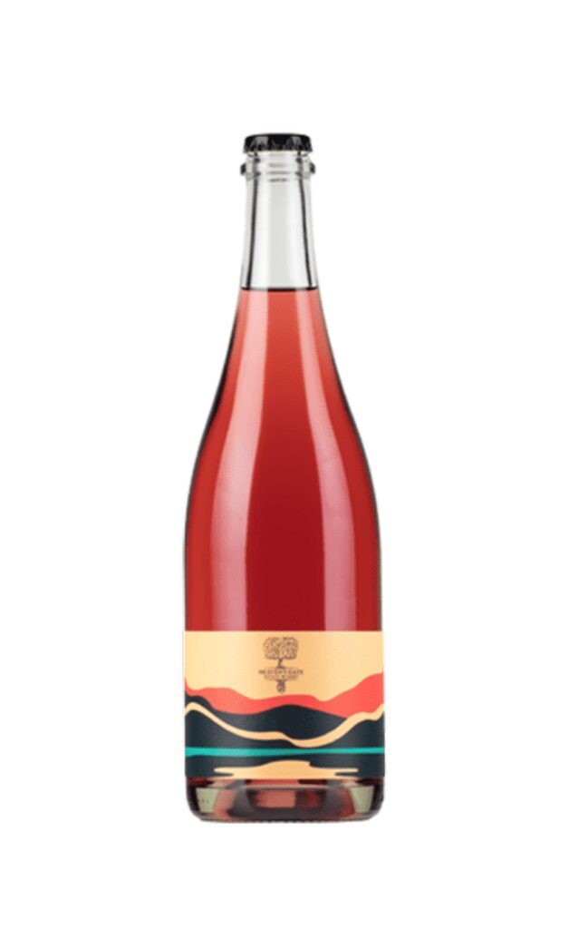 A bottle of Heaven's Gate Winery's 2020 Gamay Sparkling on a white background.